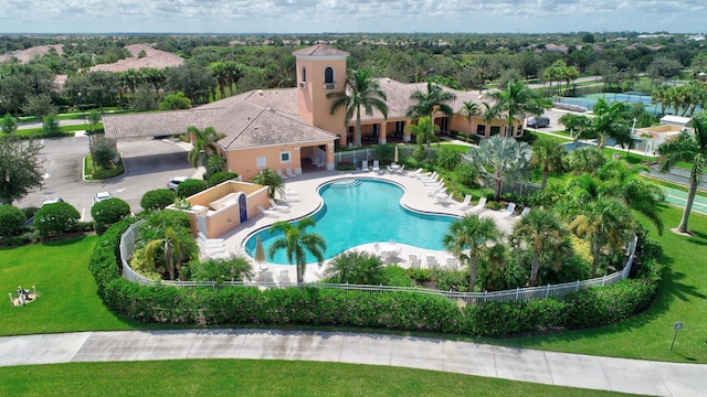 view of pool featuring a patio area and a lawn