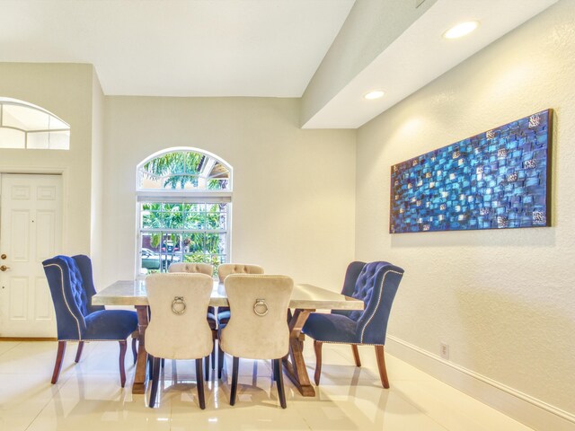 dining space featuring tile patterned flooring