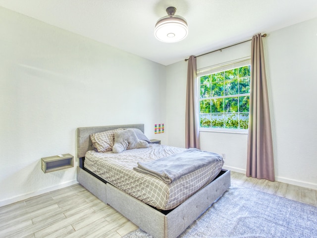 bedroom with light hardwood / wood-style floors