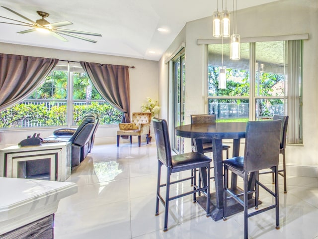 dining space with ceiling fan, light tile patterned floors, and a wealth of natural light