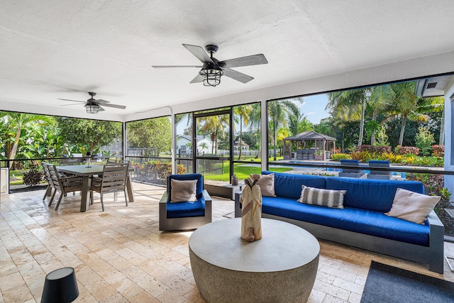 view of patio / terrace with ceiling fan, outdoor lounge area, and a gazebo