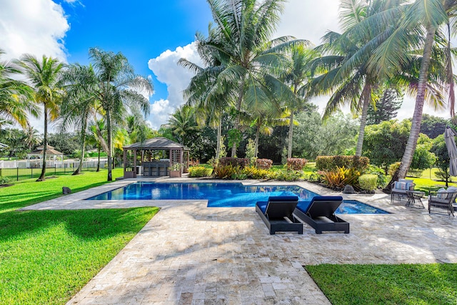 view of swimming pool featuring a patio area, a lawn, and a gazebo