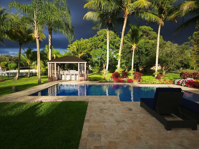 view of pool featuring a patio, a yard, and a gazebo