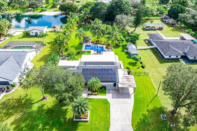 birds eye view of property with a water view