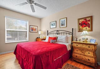 bedroom featuring ceiling fan and hardwood / wood-style flooring