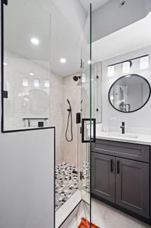 bathroom with vanity and an enclosed shower