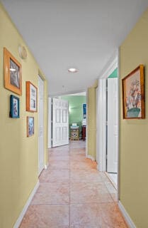 hallway with light tile patterned flooring