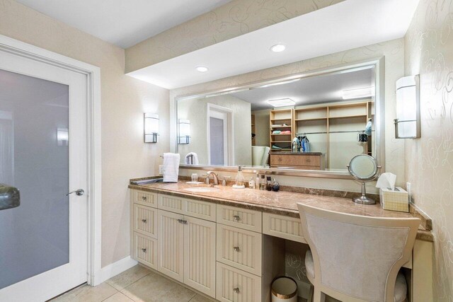 1800 S Ocean Blvd Unit 2A, Boca Raton, FL 33432 - bathroom with vanity, tile patterned floors, a spacious closet, recessed lighting, and baseboards