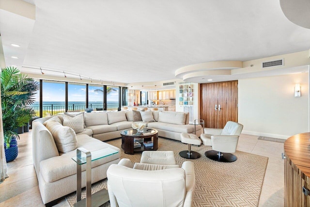 1800 S Ocean Blvd Unit 2A, Boca Raton, FL 33432 - tiled living room with baseboards and a water view