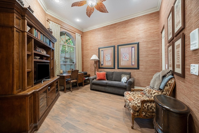 home office featuring ornamental molding, light hardwood / wood-style floors, a textured ceiling, and ceiling fan