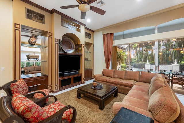 living room featuring ornamental molding and ceiling fan