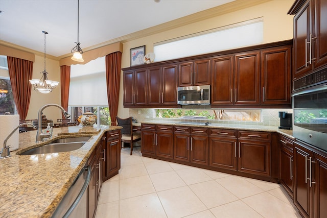 kitchen with tasteful backsplash, crown molding, appliances with stainless steel finishes, pendant lighting, and sink