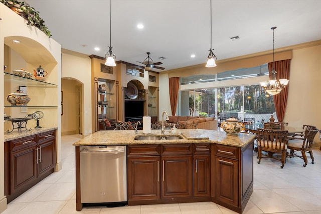 kitchen with dishwasher, a kitchen island with sink, sink, and pendant lighting