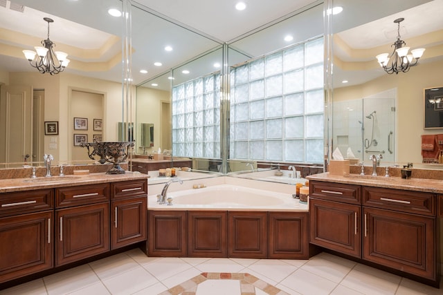 bathroom with independent shower and bath, tile patterned flooring, a tray ceiling, and a notable chandelier