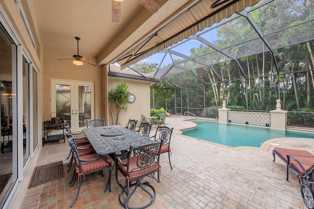 view of pool with a patio, french doors, a lanai, and ceiling fan