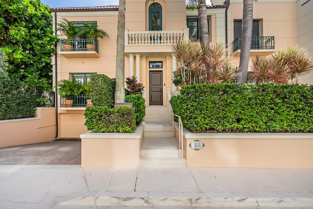 doorway to property with a balcony