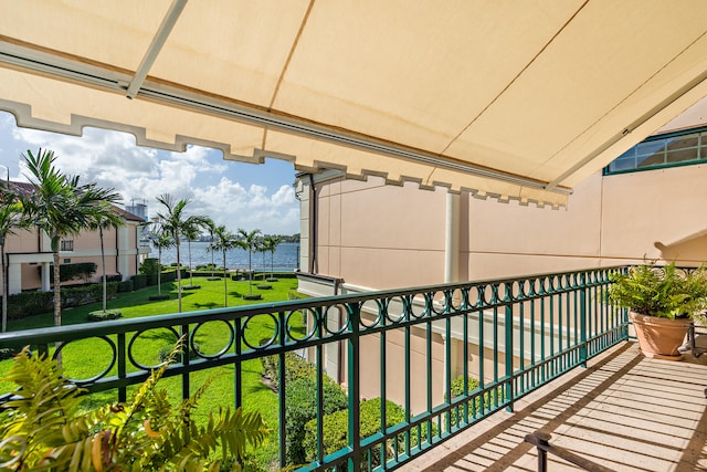 balcony featuring a water view