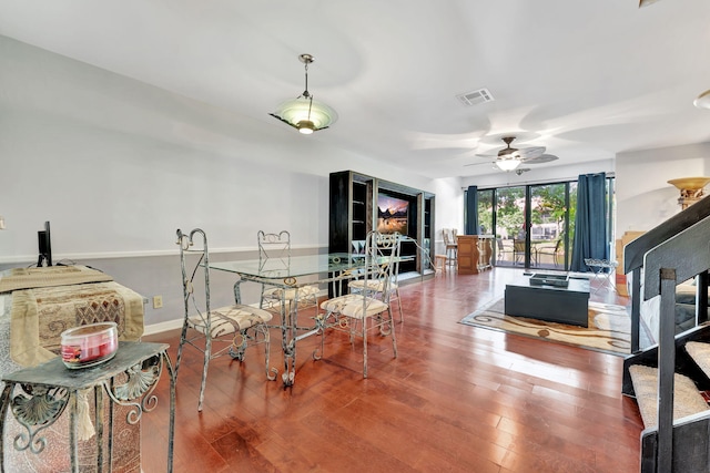 living room with hardwood / wood-style flooring and ceiling fan