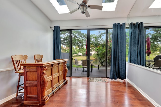 doorway to outside featuring hardwood / wood-style floors and ceiling fan