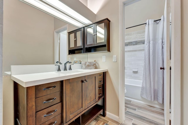 bathroom featuring shower / bath combination with curtain, vanity, and hardwood / wood-style flooring