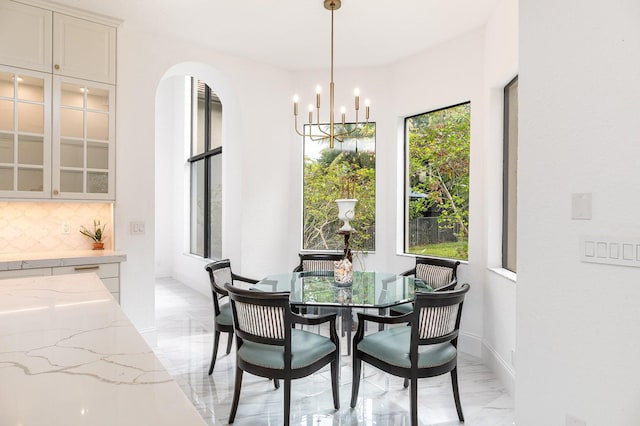 dining space with a chandelier