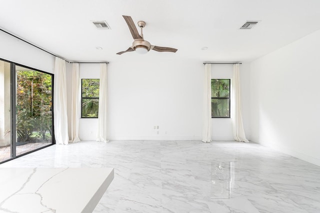 unfurnished room with ceiling fan