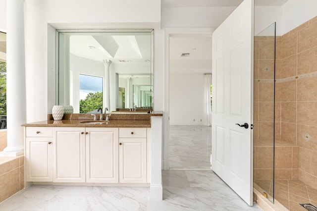 bathroom featuring vanity and a tile shower