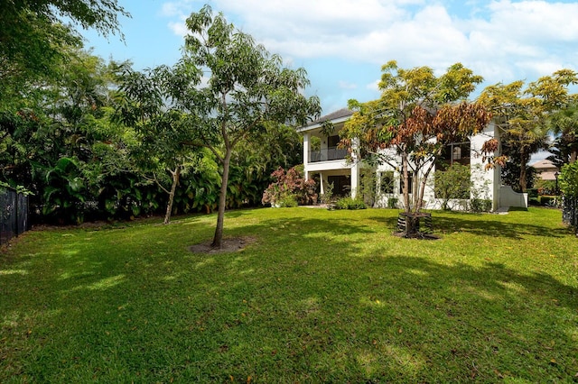 view of yard featuring a balcony