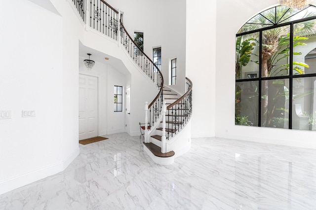 foyer entrance featuring a high ceiling