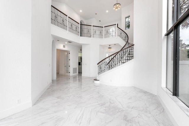 entrance foyer with a towering ceiling