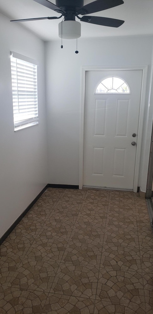 foyer featuring ceiling fan