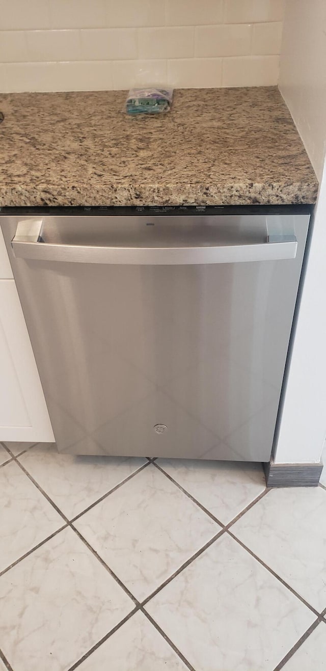 details featuring white cabinetry and dishwasher