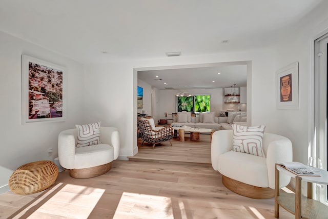 sitting room featuring light hardwood / wood-style floors