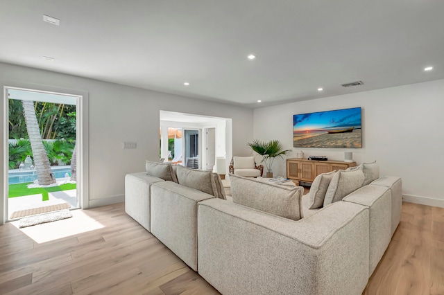 living room with light hardwood / wood-style flooring