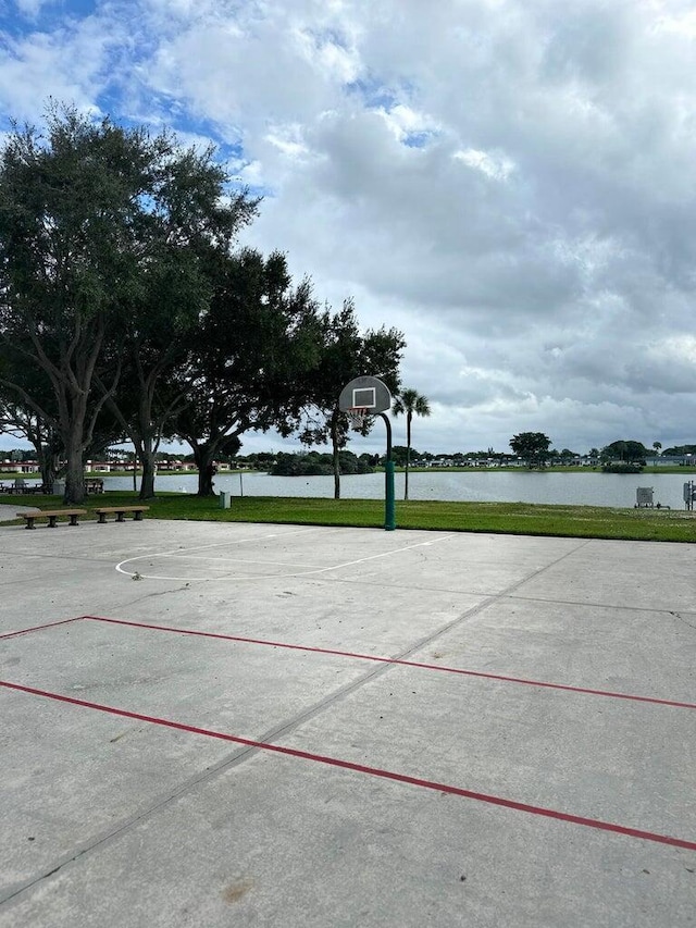 view of basketball court with a water view