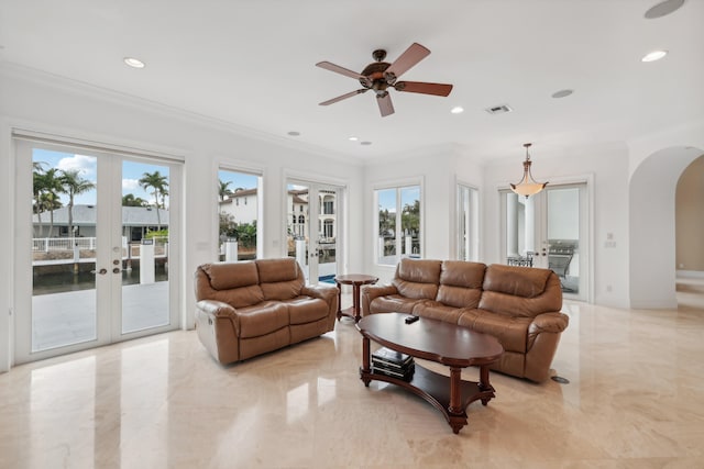 living room featuring ornamental molding, french doors, plenty of natural light, and ceiling fan