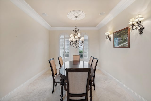 carpeted dining area with ornamental molding, a chandelier, and a tray ceiling