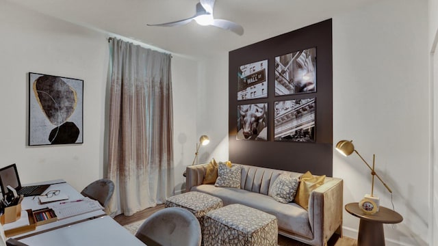 home office featuring hardwood / wood-style floors and ceiling fan