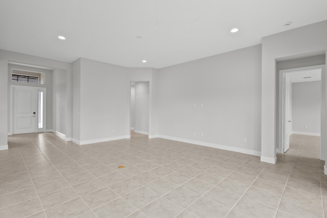 unfurnished room with light tile patterned floors