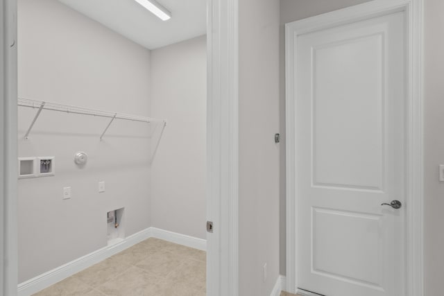 washroom with hookup for an electric dryer, gas dryer hookup, washer hookup, and light tile patterned floors