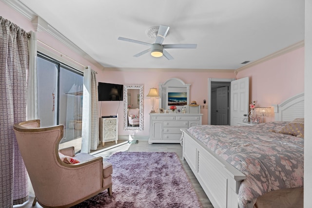 bedroom featuring light wood-type flooring, ceiling fan, and crown molding