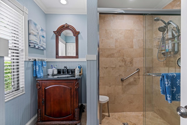 bathroom with ornamental molding, an enclosed shower, and vanity