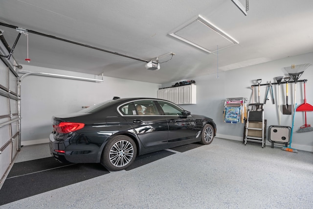 garage featuring a garage door opener