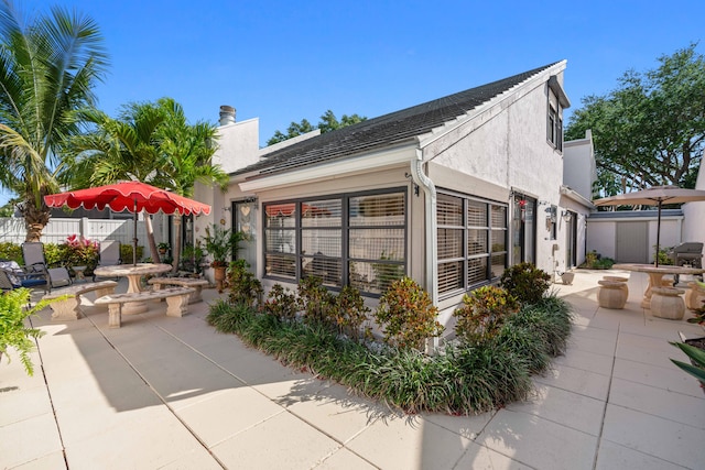 view of home's exterior with a patio