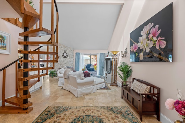 living room featuring high vaulted ceiling