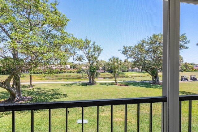 view of yard with a balcony