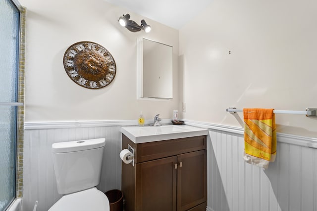 bathroom with toilet and vanity