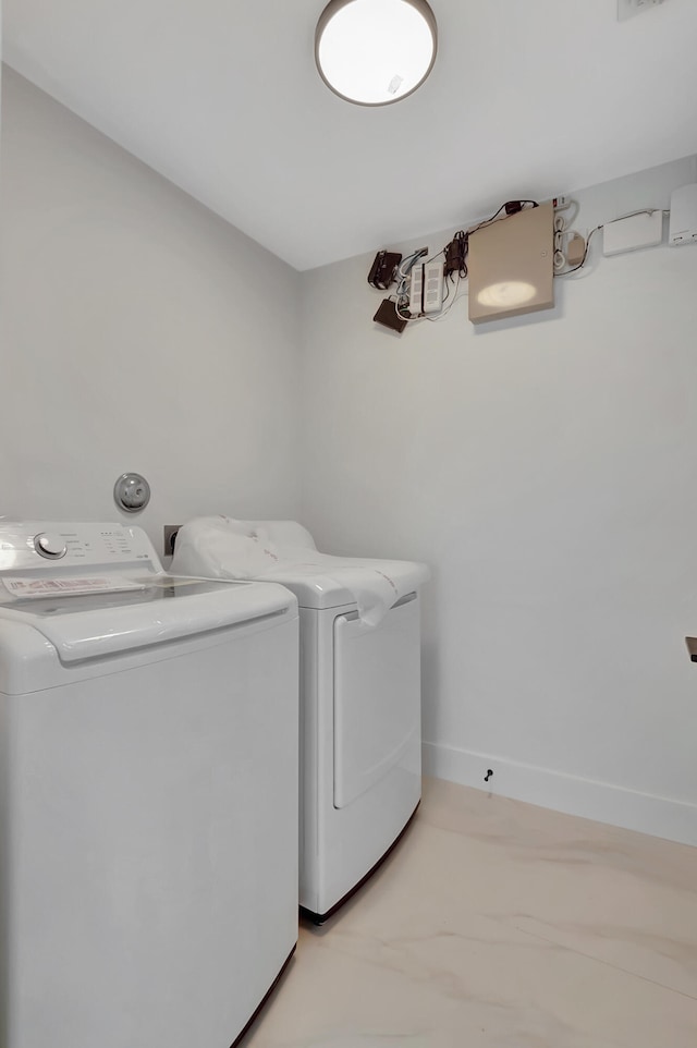 laundry room featuring washing machine and dryer