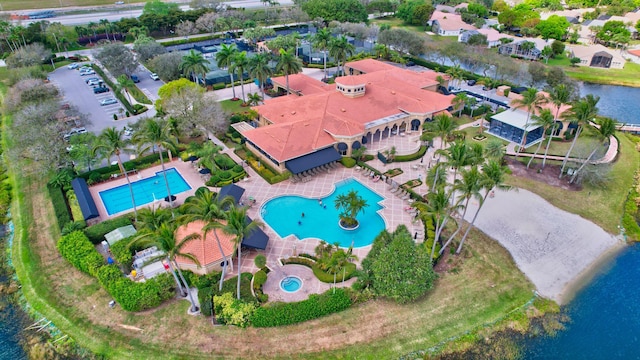 birds eye view of property with a water view