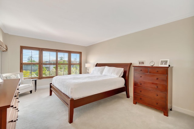 carpeted bedroom featuring crown molding